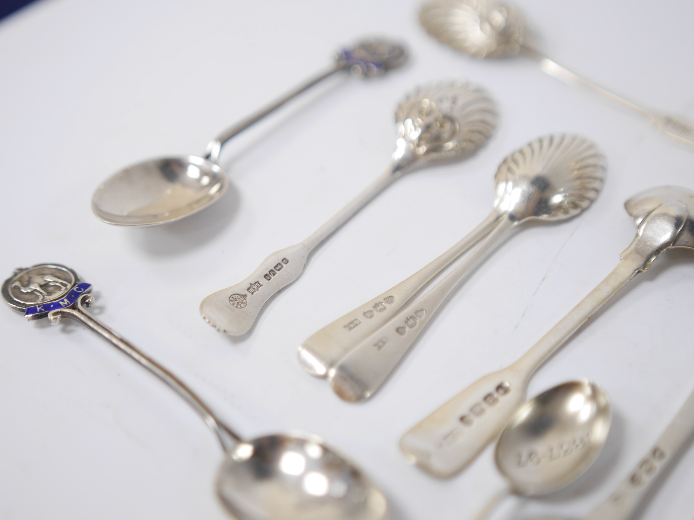 A quantity of assorted mainly 19th century and later silver flatware, including two Queens pattern sauce ladles, seventeen teaspoons, six mustard ladles, a toddy ladle, etc, and a silver pencil holder, various dates and